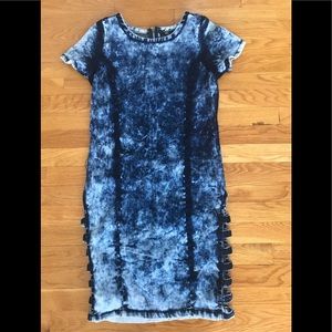 Stone-washed denim dress with side slits.